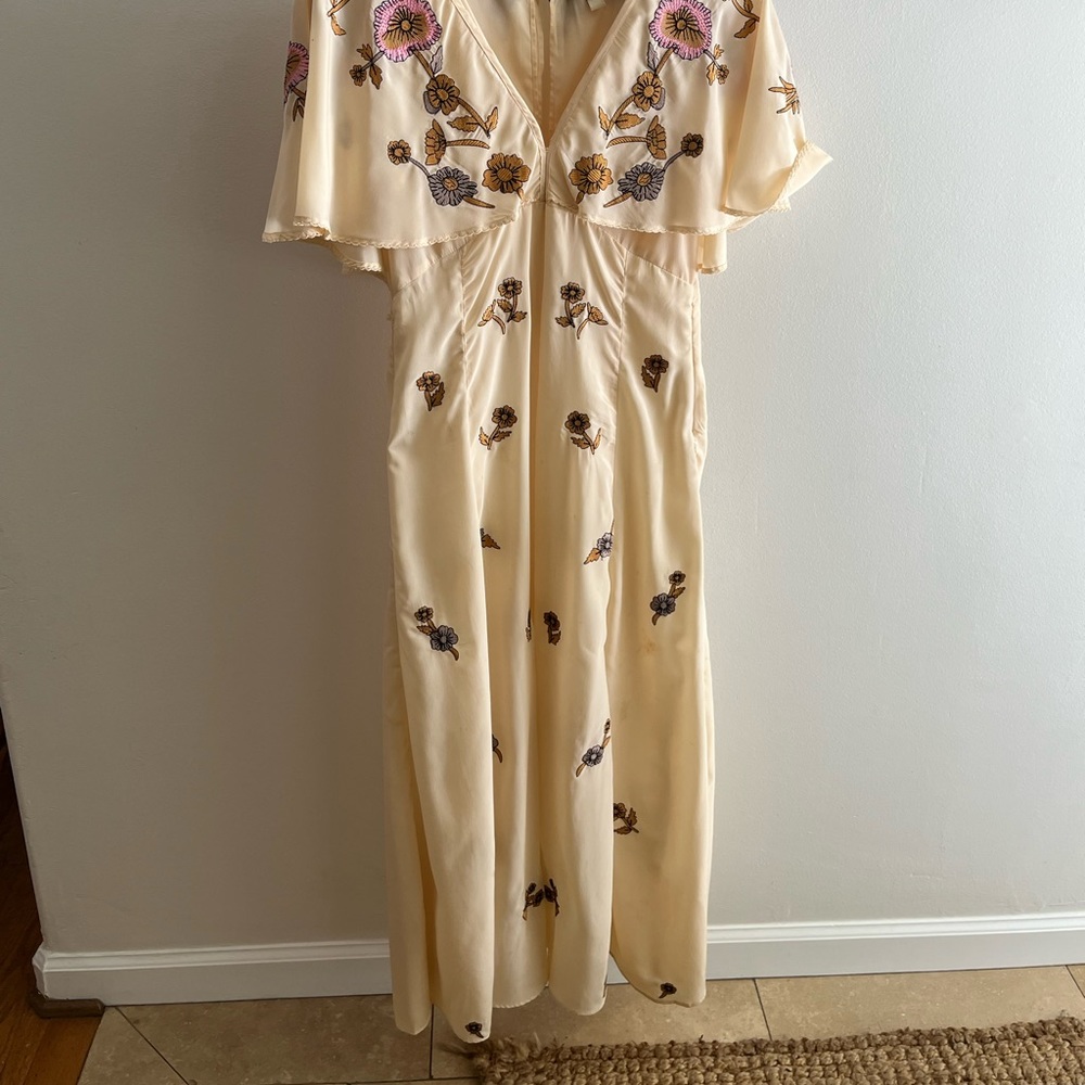 Pale yellow satin Cleo Bella dress with embroidery.